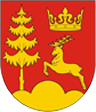 Herb Gminy. Złoty jeleń, korona oraz drzewo na czerwonym tle